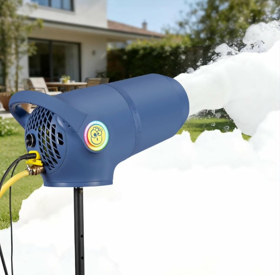 Blue foam machine on a stand shooting a thick plume of white foam across a backyard